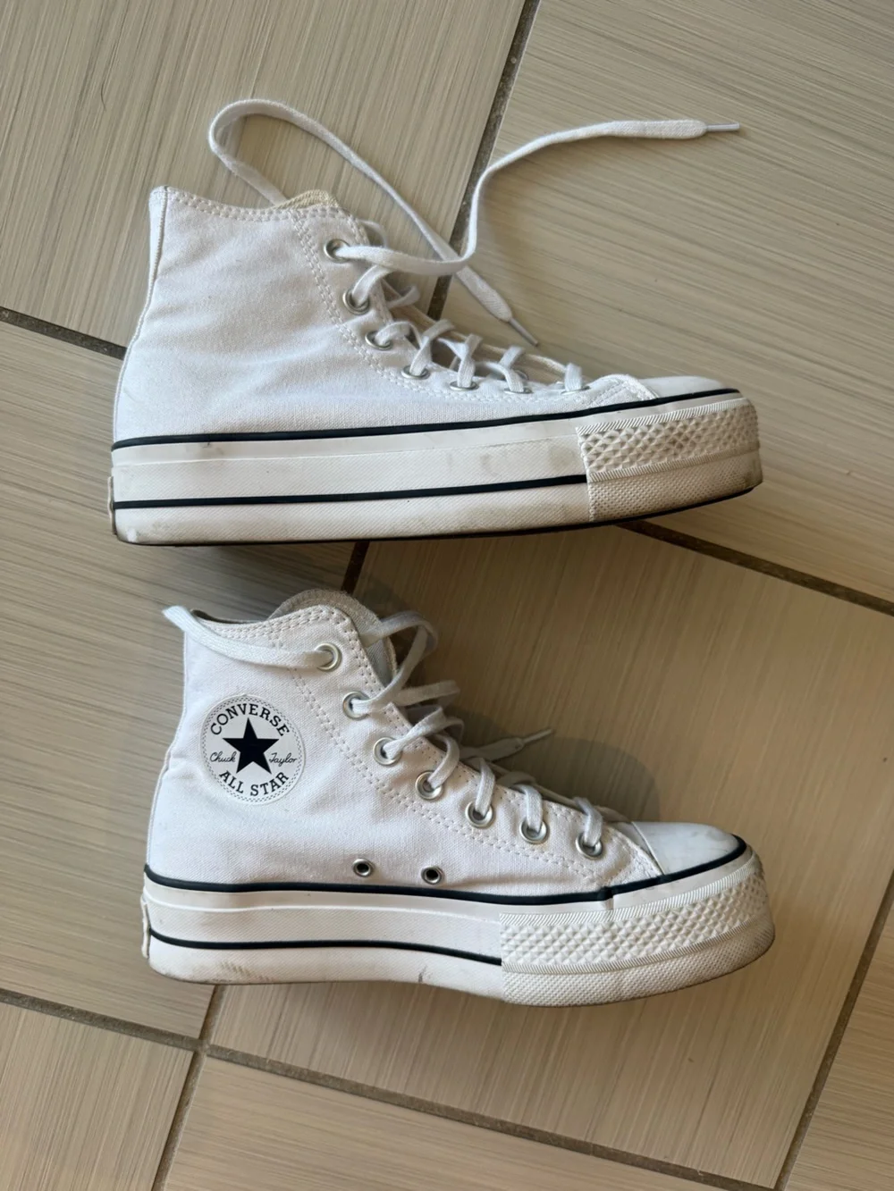 Converse Chuck Taylor’s White High Top Platform Sneakers